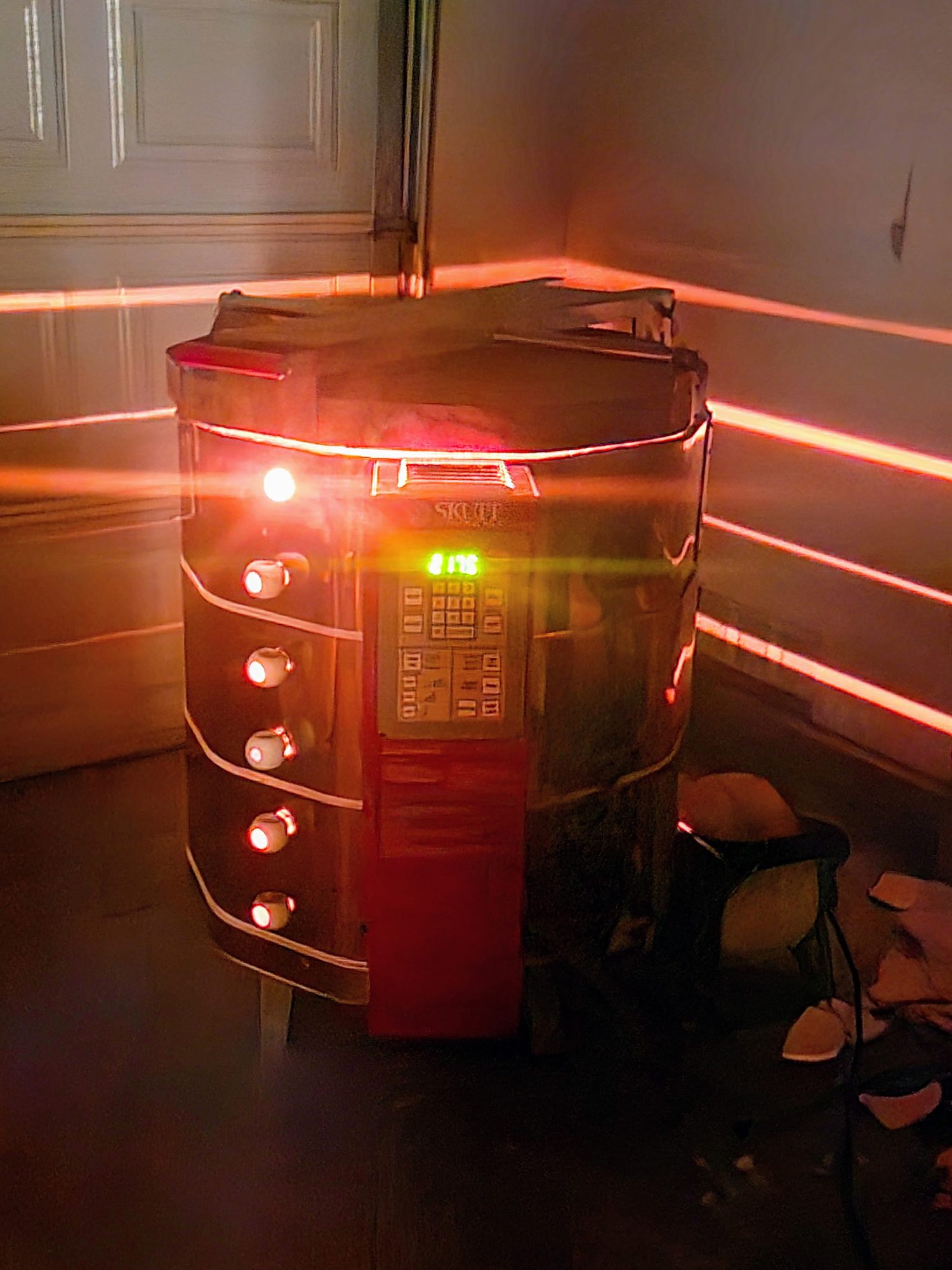 Electric kiln glowing red through its seams mid-firing